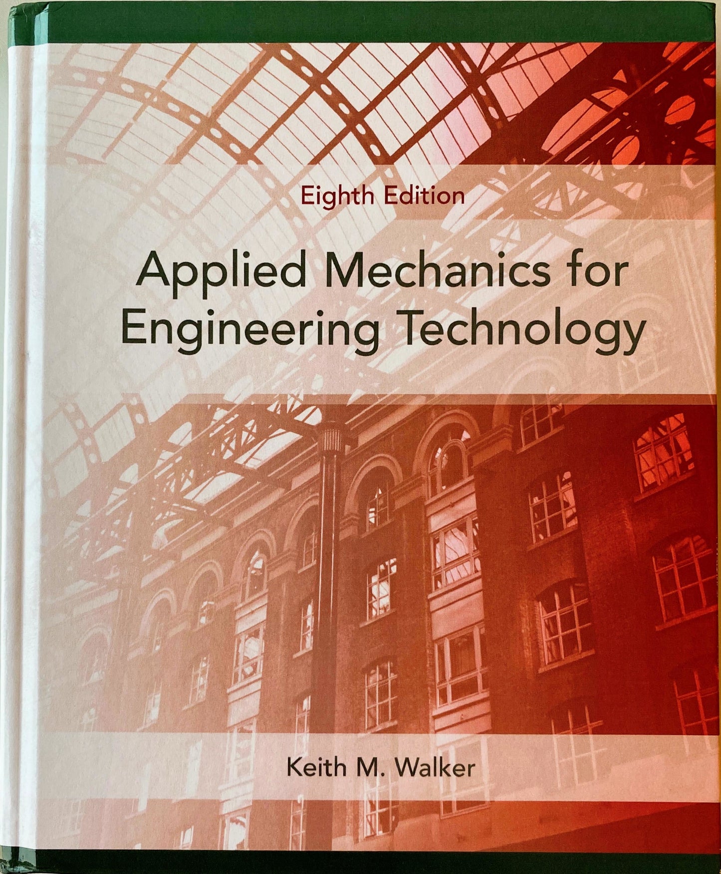 Book titled 'Applied Mechanics for Engineering Technology' by Keith M. Walker with a red and white architectural design on the cover.