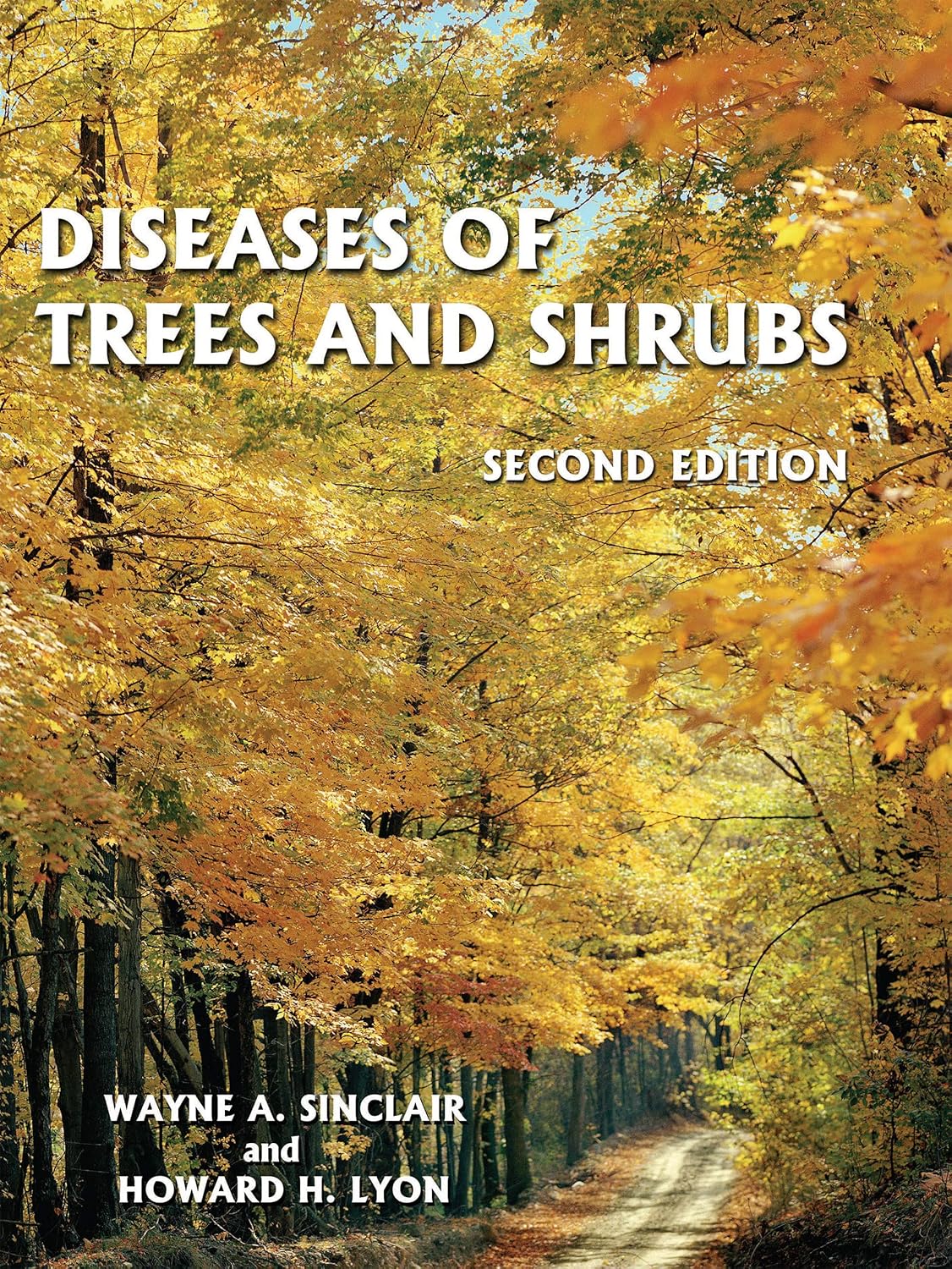Book cover of 'Diseases of Trees and Shrubs' with autumn foliage background