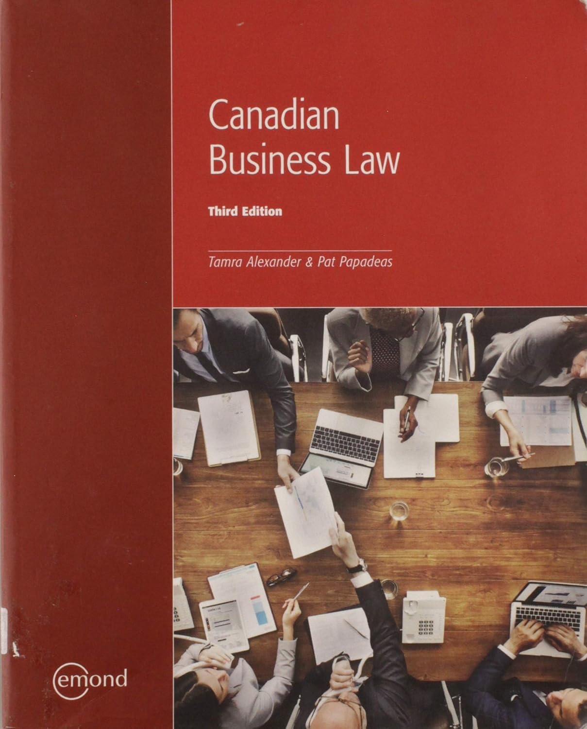 Book cover of 'Canadian Business Law' with people at a table working on documents.