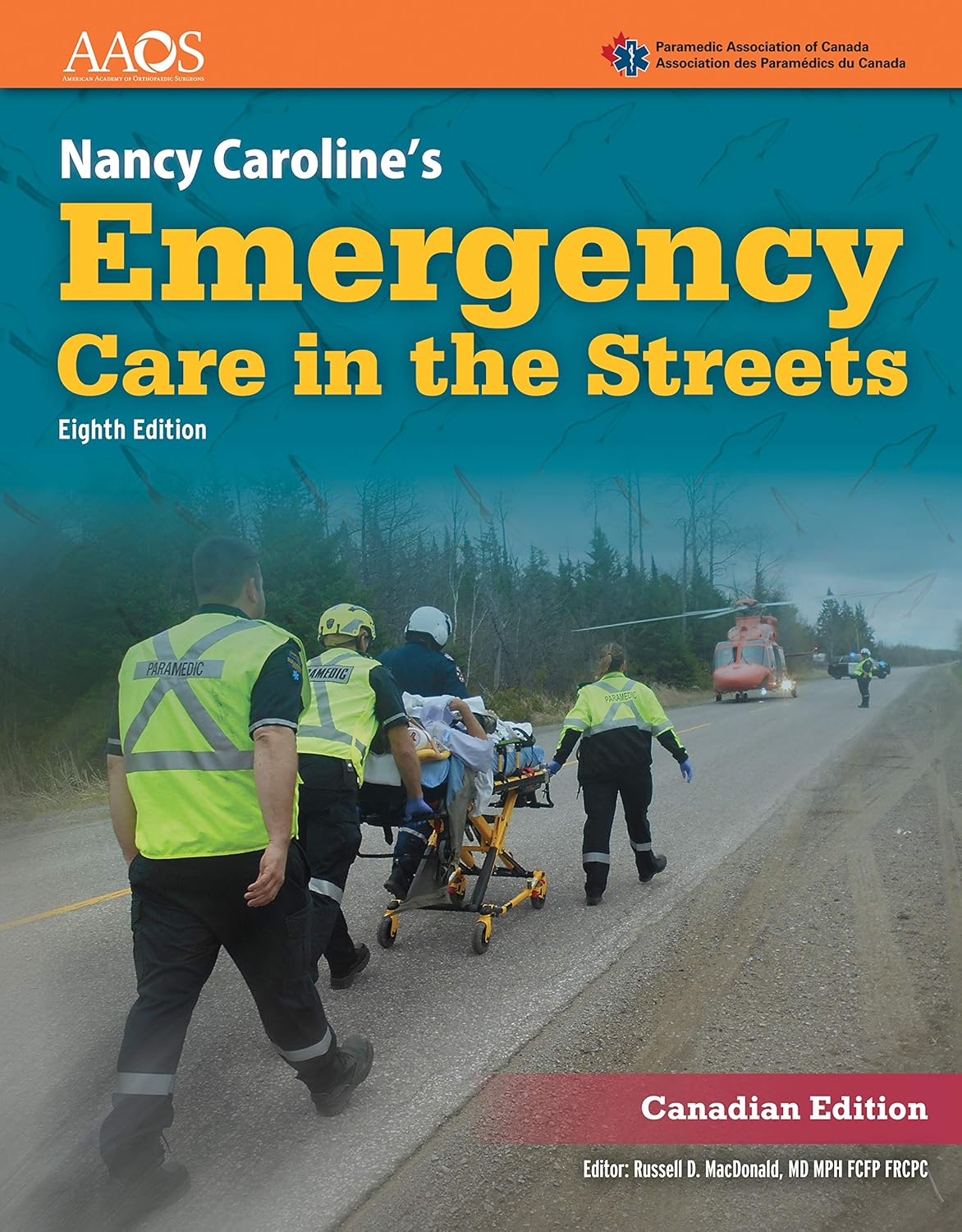 Book cover of 'Emergency Care in the Streets' with emergency responders on a road.
